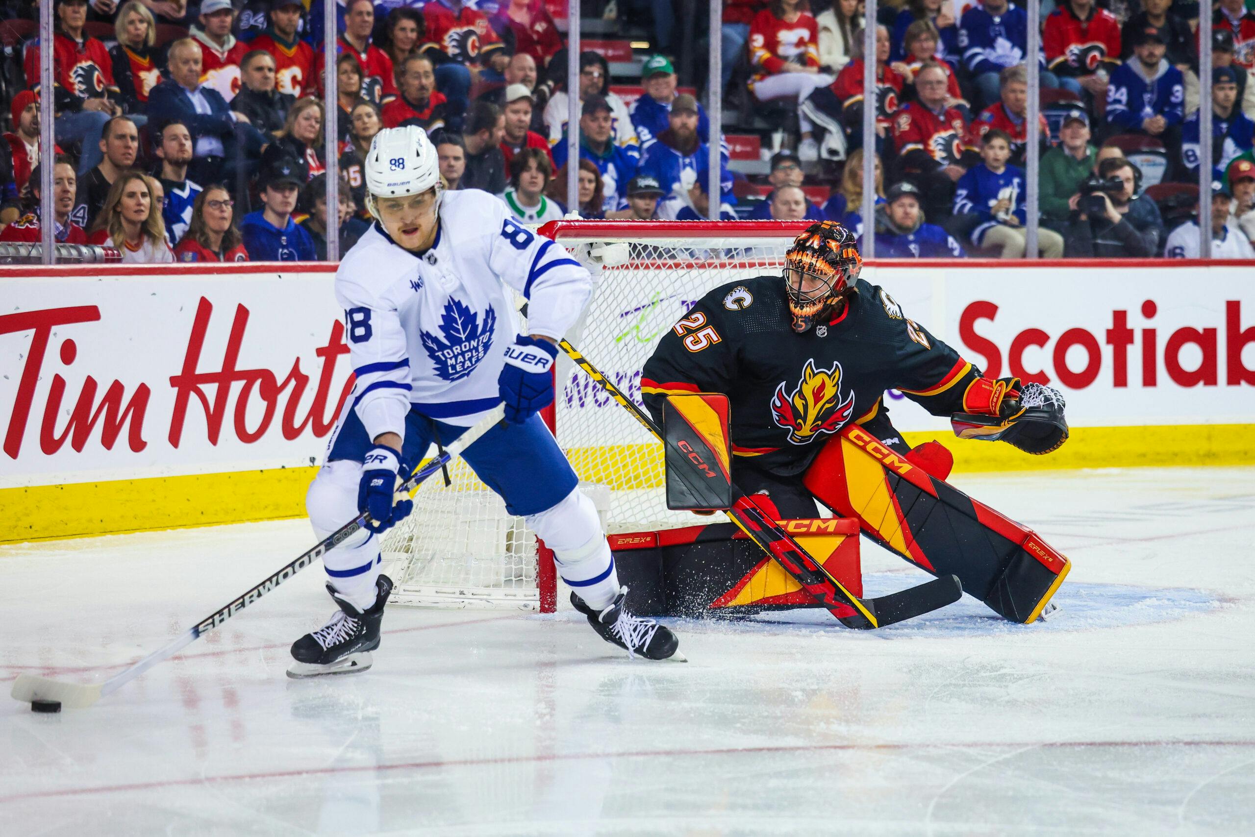 William Nylander of the Toronto Maple Leafs and Jacob Markstrom of the Calgary Flames.